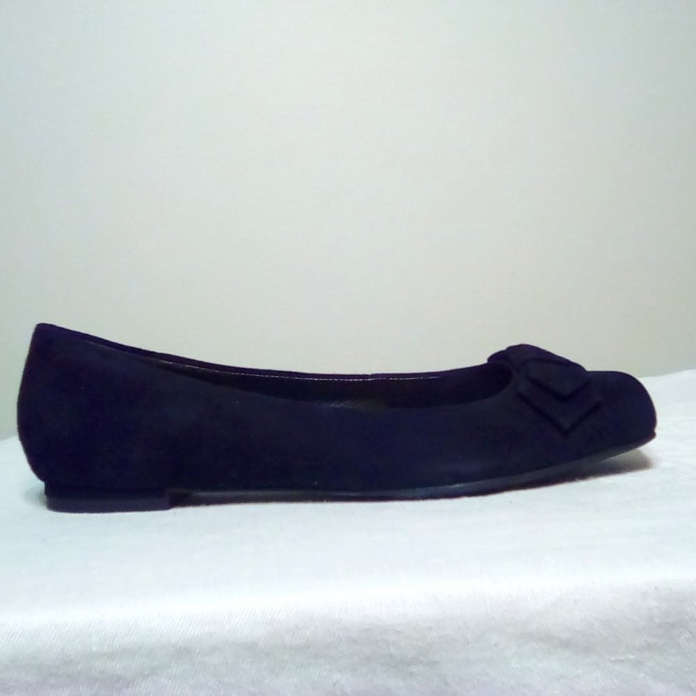 Black suede flats with bow detail